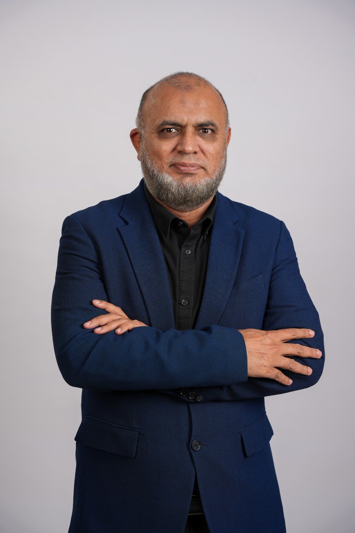 Masood Hassan Qureshi in a navy jacket